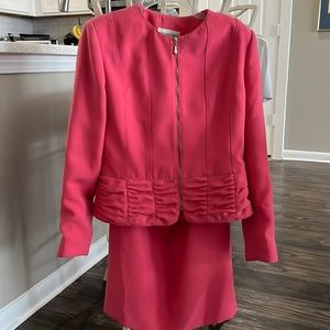 Pink skirt and jacket suit. Skirt has back slit and hook and zipper close